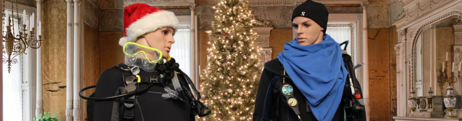 Two divers in festive wear in front of a decorated tree